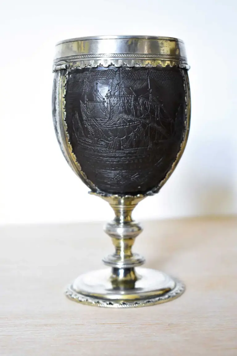 AN EARLY 18TH CENTURY COCONUT CHALICE MOUNTED IN 17TH CENTURY ‘PIRATE’ SILVER